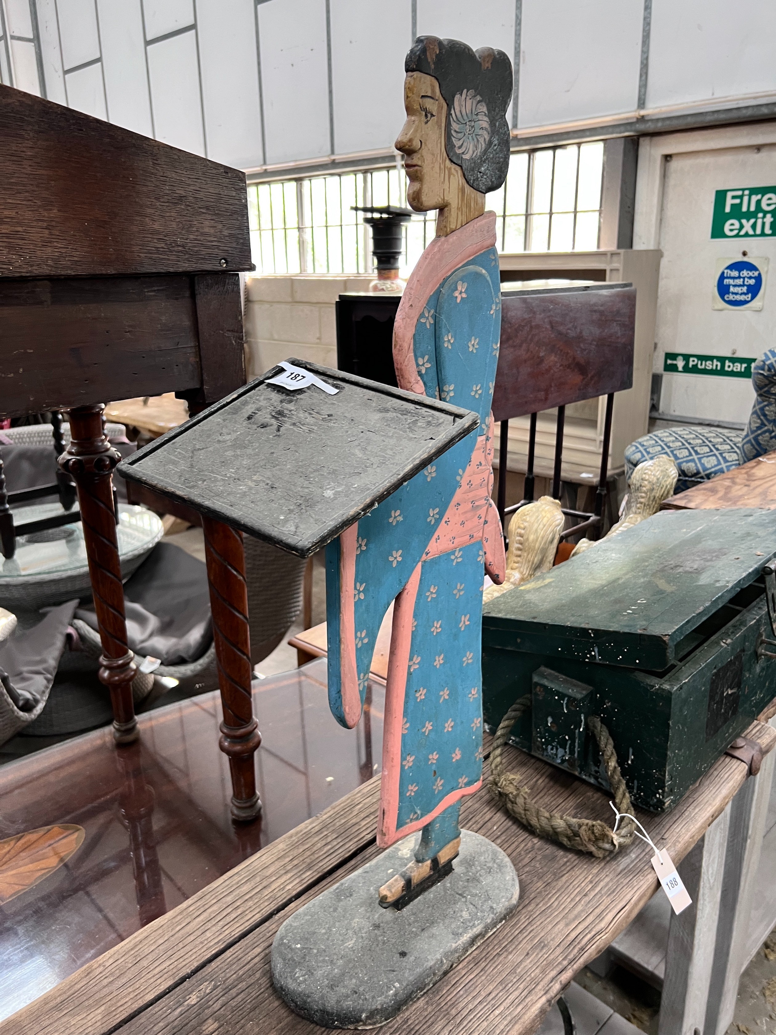 A painted wood figural dumb waiter, height 93cm *Please note the sale commences at 9am.